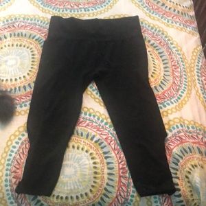 Black capri leggings with cross cross cutout detail on legs L/XL
